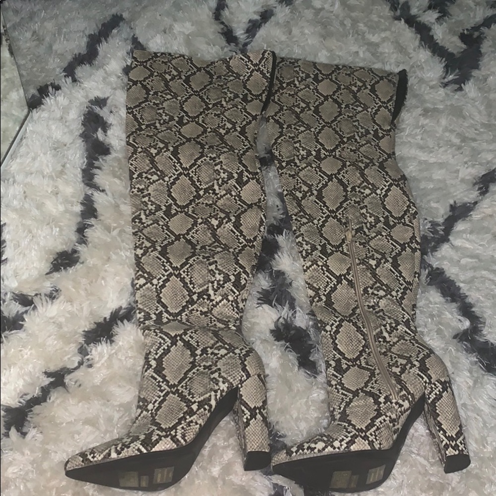 Thigh high snake skin boots